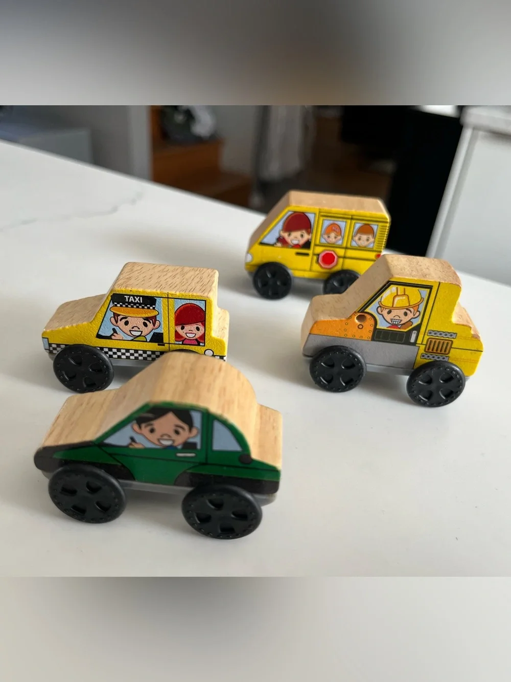 8 wooden cars and trucks.  Four are kidKraft.